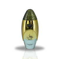 A close-up view of the Remas Eau De Parfum bottle by Lattafa, showcasing its elegant gold and intricate design with a luxurious aesthetic.