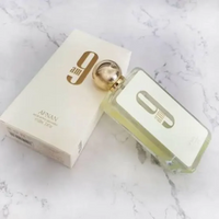 Afnan 9am perfume bottle placed stylishly on a marble surface - An elegant and fresh scent for all occasions.