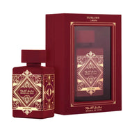 Bade’e Al Oud Sublime Eau De Parfum by Lattafa, showcasing a luxurious red bottle with intricate gold patterns and matching red and gold packaging.