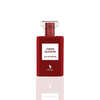 Cherie Blossom Eau De Parfum 100ml by Volare, showcasing a sleek red bottle with a modern design and clear cap, embodying its floral and fruity fragrance.