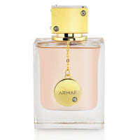 A close-up of the luxurious Club De Nuit for Women perfume bottle by Armaf, showcasing its minimalist design and shimmering golden accents.