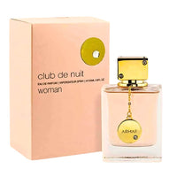 Club De Nuit for Women EDP (105ML) by Armaf, featuring a stylish gold-accented bottle alongside its sophisticated beige and gold packaging.