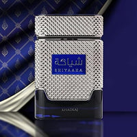 Khadlaj Shiyaaka Blue Eau De Parfum for Men, featuring a luxurious silver and blue grooved metallic bottle against a royal blue background.