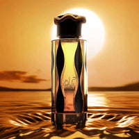 Lattafa Teriaq Intense perfume bottle glowing in front of a golden sunset over shimmering water – luxury Arabian fragrance.