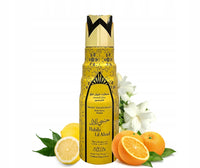 Habibi Lil Abad Deodorant Spray by Nabeel in a luxurious gold and black bottle, surrounded by fresh lemons, oranges, and white jasmine flowers, emphasizing its citrusy and floral fragrance